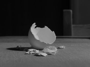 Close-up of broken glass on table