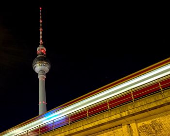 Low angle view of berlin tv tower at night