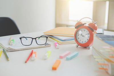 Close-up of school supplies at desk