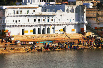 Pilgrims at pushkar lake on sunny day