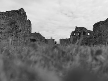 Old ruin building against cloudy sky