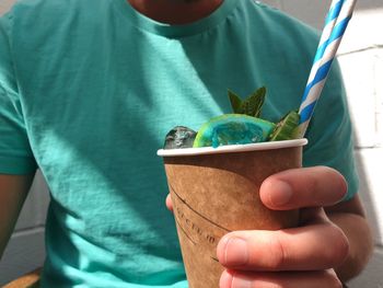 Close-up of hand holding ice cream