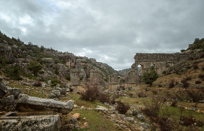 View of old ruin building against cloudy sky