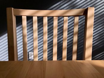 High angle view of blinds on hardwood floor