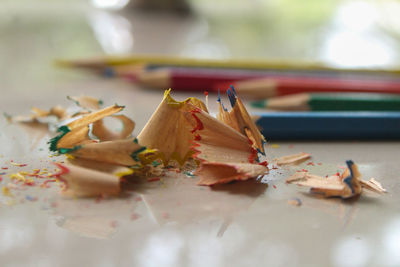 Close-up of multi colored pencils on table