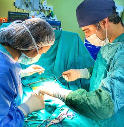 Doctors working in operating room