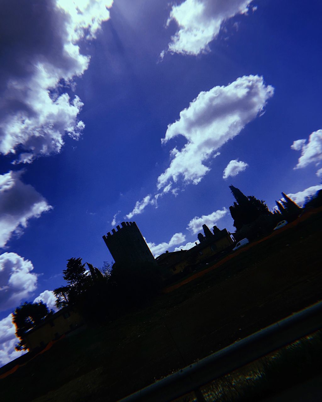 cloud - sky, sky, architecture, low angle view, built structure, building exterior, nature, blue, no people, building, day, outdoors, silhouette, beauty in nature, tilt, environment, sunlight, tree, plant, house