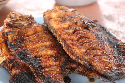 High angle view of meat on barbecue grill