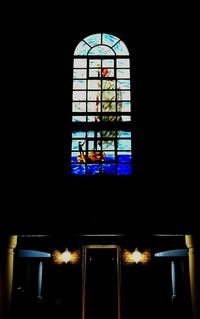 Illuminated window in dark room