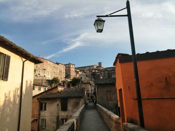 Street amidst buildings against sky