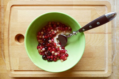 High angle view of strawberries in bowl on table