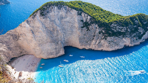 High angle view of rocks by sea