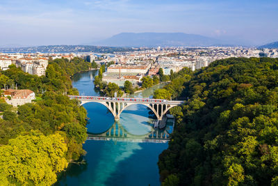 High angle view of bridge over river in city against sky