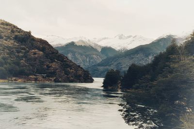 Scenic view of mountains and sea against sky