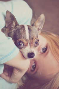 Portrait of girl embracing chihuahua