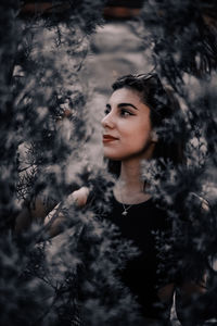 Portrait of young woman looking away