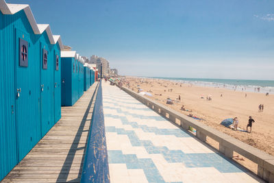 Blue beach huts by the sea