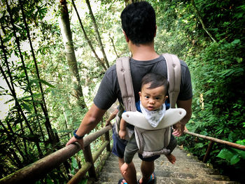 Full length of father and daughter in forest