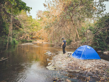 Summer camping tent near the stream.