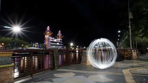 Illuminated ferris wheel at night