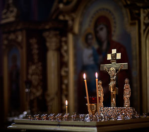 Lit candles by jesus christ at church