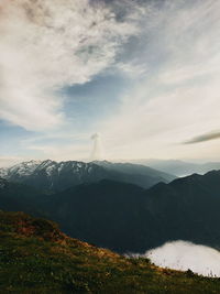 View of mountain range against cloudy sky