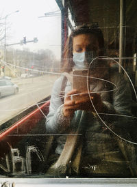 Man photographing through car window