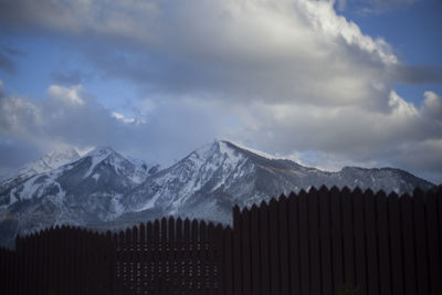 Scenic view of snowcapped mountains against sky