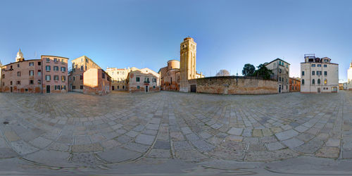 View of buildings against blue sky