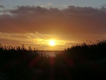 Scenic view of silhouette landscape against sky during sunset