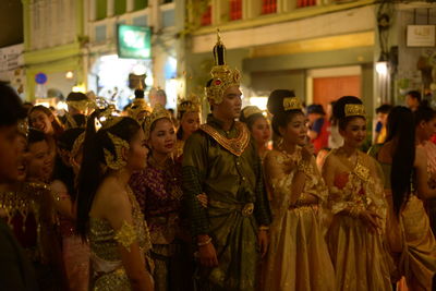 Group of people in market during night