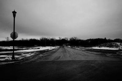 Road passing through snow covered landscape