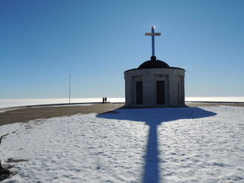 Building against clear blue sky during winter