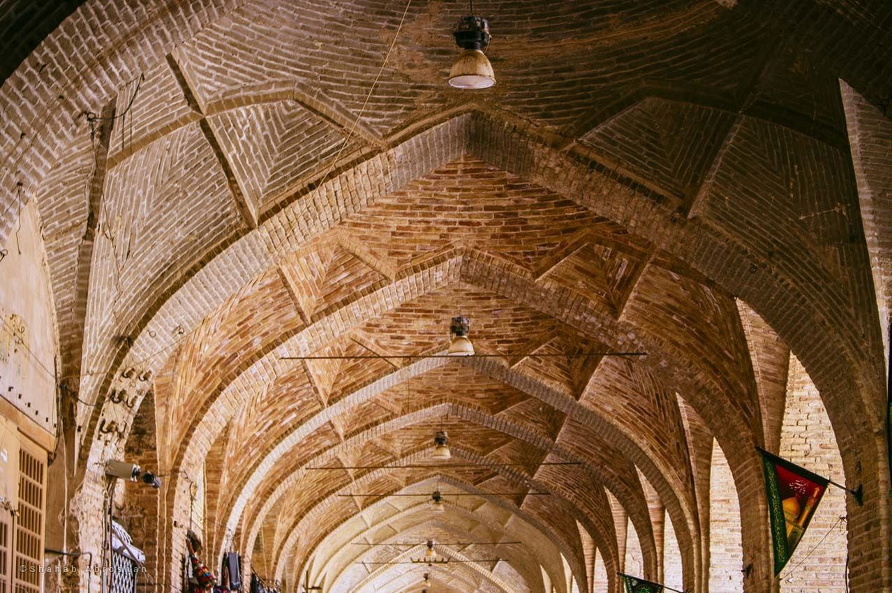 architecture, ceiling, indoors, built structure, arch, no people, the past, low angle view, architectural column, history, building, travel destinations, day, place of worship, religion, lighting equipment, pattern, arcade, belief, abbey, gothic style, architecture and art