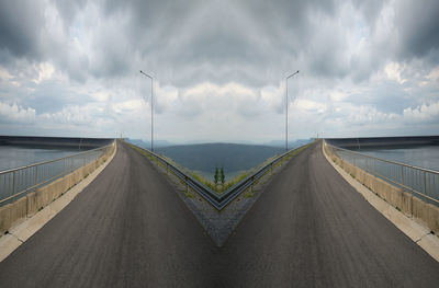 Panoramic view of bridge over road against sky