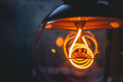 Close-up of illuminated light bulb