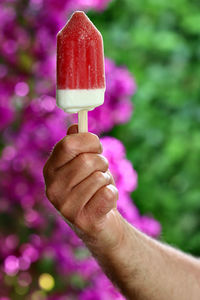Close-up of hand holding ice cream cone