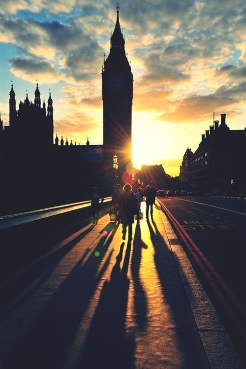 sunset, architecture, building exterior, built structure, sun, sky, orange color, silhouette, city, transportation, travel destinations, tower, cloud - sky, travel, sunlight, famous place, sunbeam, tourism, city life