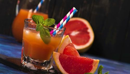 Close-up of juice with drink on table