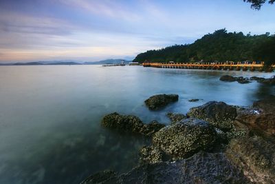 Scenic view of sea against cloudy sky