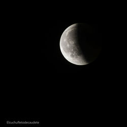 Low angle view of moon against sky at night