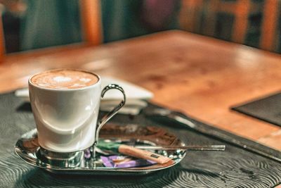 Close-up of coffee cup on table