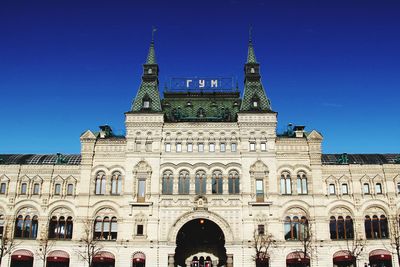 Low angle view of building against blue sky