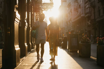 Rear view of man walking on street