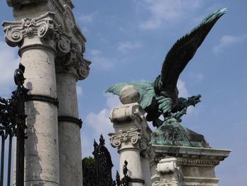 Low angle view of statue against sky