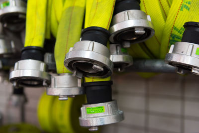 Close-up of hoses hanging indoors