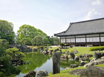 Scenic view of lake and temple in kyoto