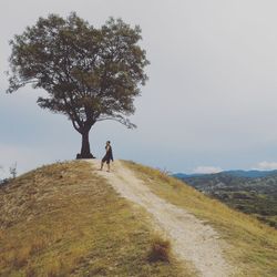 Full length of man on field against sky
