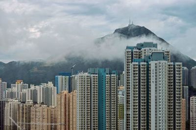 Buildings in city against sky