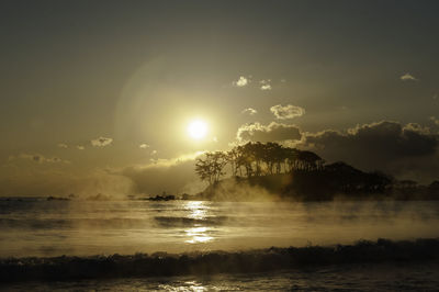 Scenic view of sea against sky during sunrise